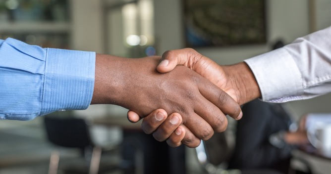 people shaking hands
