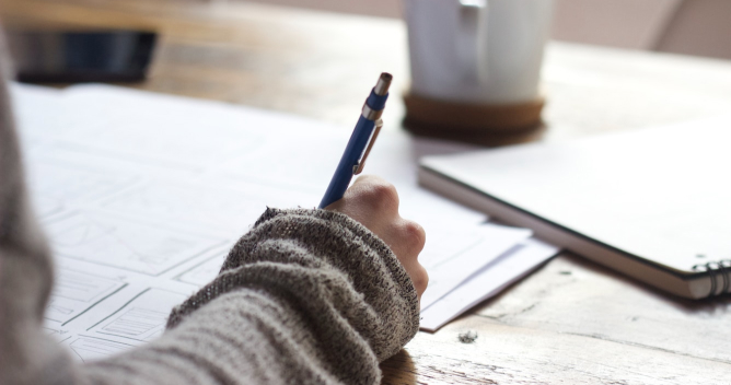 person writing
