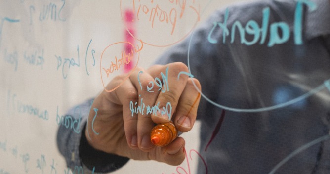 person writing
