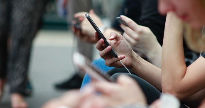 people watching cell phone
